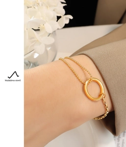 Detail of 18K gold-plated stainless steel bracelet featuring bead and box chain combo