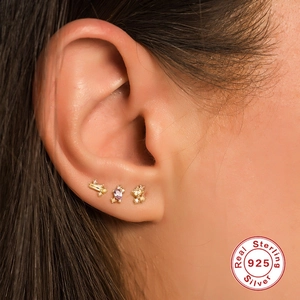 Three-piece set of S925 sterling silver studs with purple and yellow zircons on ear
