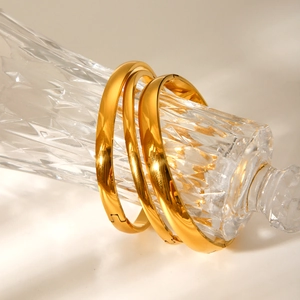 Three-piece gold-plated stainless steel bangles set with a polished mirror finish