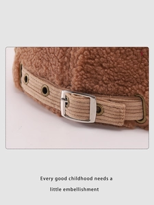 Detail of child bear beanie with brown sherpa fleece and adjustable corduroy strap