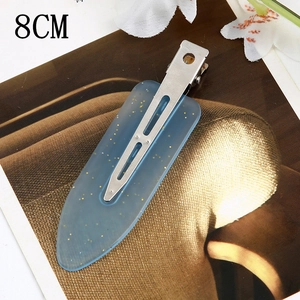 Detail of 8cm light blue acetate hair clip with gold glitter and silver metal clamp