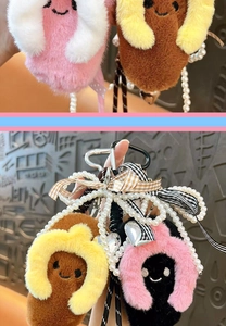 Close-up detail of a cute plush slipper keychain featuring pearl chains and plaid ribbons