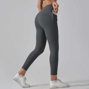 Detail view of high waist yoga leggings with functional side pocket for mobile phone