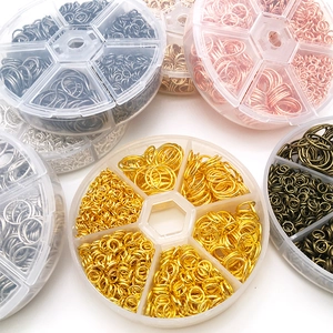 Multiple boxes of colorful metal open jump rings for DIY jewelry making accessories