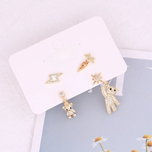 Copper micro-pave zircon earring set featuring carrot, lightning, and bear designs
