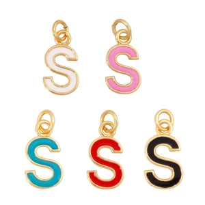 Macro view of colorful enamel S-letter pendants with gold metal frames and open rings