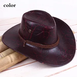 Brown western cowboy hat with leaf texture and braided strap on vintage newspaper