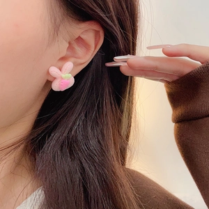 Cute pink plush rabbit stud earrings for women with soft fabric texture and silver needles