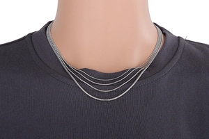 Detail of silver multi-layer snake bone chain necklace on neck in 18k vacuum plating