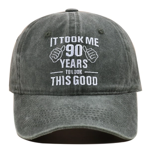 Detail of white embroidery text on charcoal grey washed cotton 90th birthday baseball cap