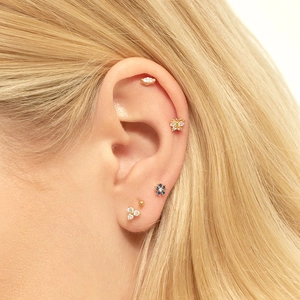 Detailed view of s925 silver snowflake and butterfly earrings set with blue zircons