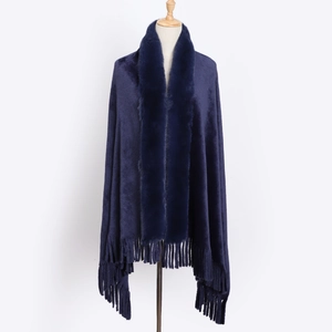 Detail of navy blue flannel shawl with faux rabbit fur collar and fringed hemline