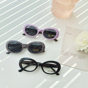 Close-up of kids oval sunglasses featuring UV400 protection in diverse trendy patterns