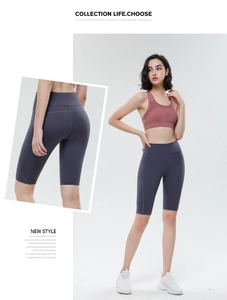 Close-up detail of high-waisted gray yoga shorts featuring side seams and body-shaping fit