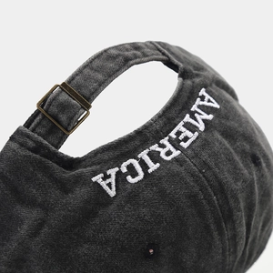 Faded cotton baseball cap with America embroidery and vintage metal buckle closure