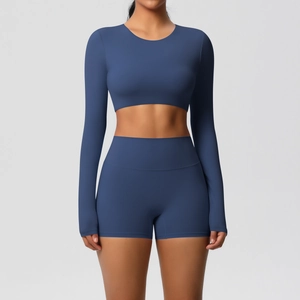 Front view of a dark blue long sleeve crop top and high waist fitness shorts set