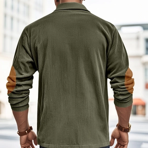 Close-up of olive green corduroy shirt featuring vintage brown elbow patch details