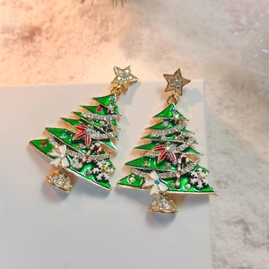 Green enamel Christmas tree earrings with sparkling rhinestones and festive star details