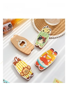 Macro view of animal-shaped wooden magnetic bottle opener with stainless steel back part