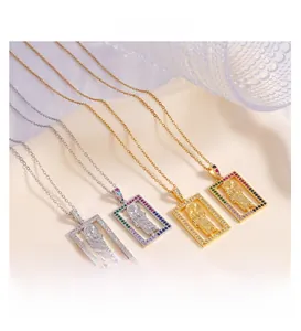 Detail of square religious pendants with 3D relief and colorful zircon stones