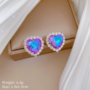 Detail of gradient blue and purple heart earrings with crystal pavé and size specs