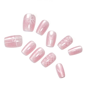 Pink press-on nails with glitter, butterfly patterns, and plaid designs in 10-piece set