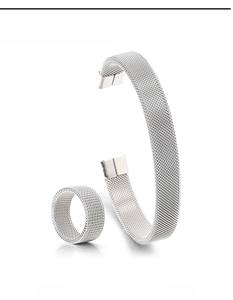 Macro detail of silver mesh weave bracelet and matching ring set in stainless steel