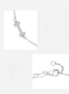 Detail of S925 silver bracelet featuring a zircon-studded I-pendant and lobster clasp