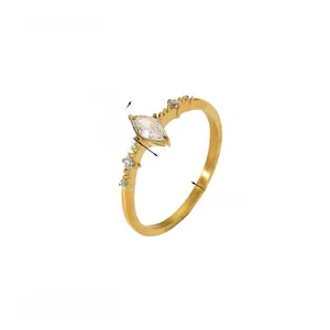 Detail view of gold titanium ring showing 7x4mm marquise zircon and 2mm band width