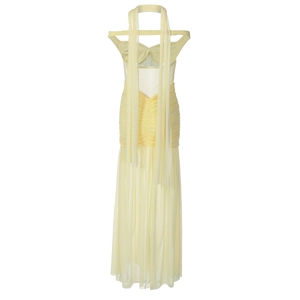 Detail of light yellow mesh dress back with elegant pleats and sheer ruffles
