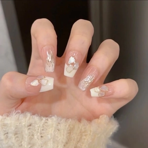 French tip coffin nails with mother of pearl accents and gold edges on pink base