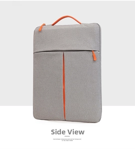 Detail of grey fabric laptop sleeve with vibrant orange handles and side zipper pocket
