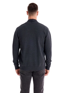 Rear view of casual men's knitted cardigan showing dark grey fabric and ribbed hem details