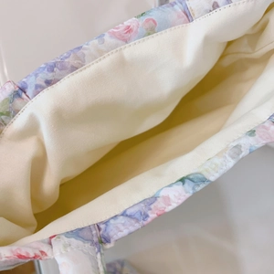 Close-up of the spacious interior and neat stitching of the floral canvas tote bag