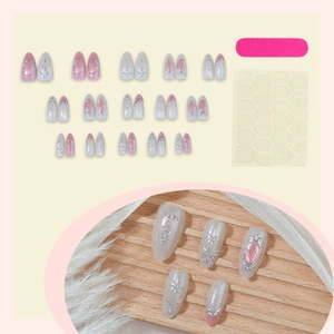 Cat eye press-on nails set with gold 3D vintage patterns and pearlescent pink almond finish
