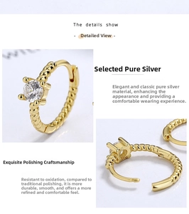 Detailed macro view of S925 sterling silver gold plated rope ring with zircon stone