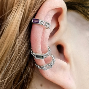 Detail showing S925 sterling silver ear cuffs with purple, green and white zircon stones