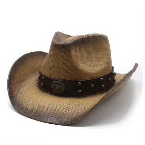 Brown woven western cowboy hat with leather band, studs and bull head emblem