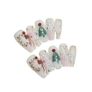Handmade Christmas long ladder press-on nails with festive tree and snowflake art