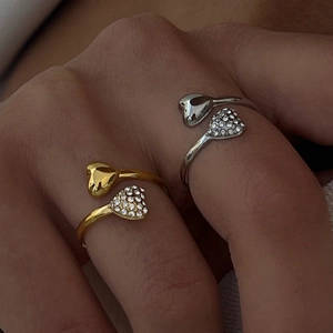 Adjustable 18k gold and silver steel rings featuring dual heart polished and paved designs