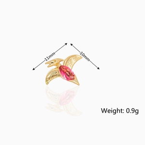 Detailed macro of gold dinosaur earring with pink zircon, size 11mm by 10mm