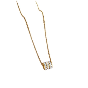 Minimalist gold titanium necklace with a sparkling cubic zirconia cylindrical pendant