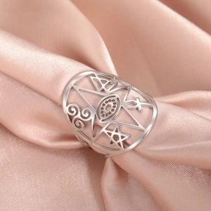Silver stainless steel open ring with hollow eye, star, and geometric symbols on pink silk