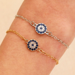 Verfijnde Turkse boze oog armband in goud en zilver met blauwe zirkoon accenten