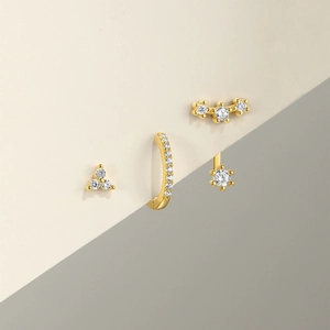 Detailed view of S925 sterling silver gold earrings with hexagram stars and zircons