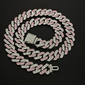 Detailed view of 14mm iced out Cuban link necklace with pink and silver cubic zirconia