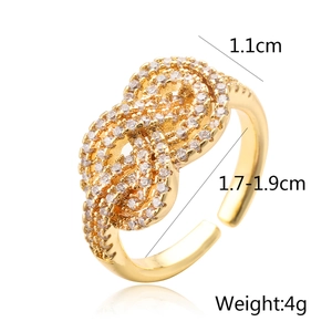 Detailed view of gold-plated infinity ring with cubic zirconia and size measurements