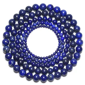 Lapis Lazuli natural stone beads with pyrite flecks in various sizes on white background