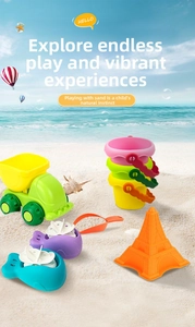 Toddler beach toy set with a dump truck, sand buckets, shovels and sea life molds