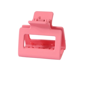 Detailed view of pink 5cm square matte hair claw clip with internal spring structure